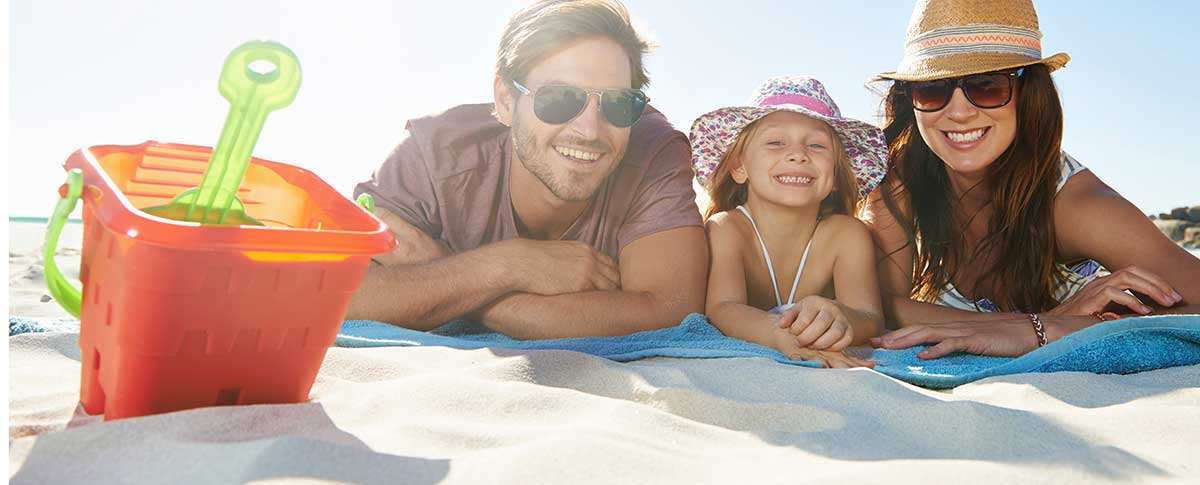 Family on the sand at the beach